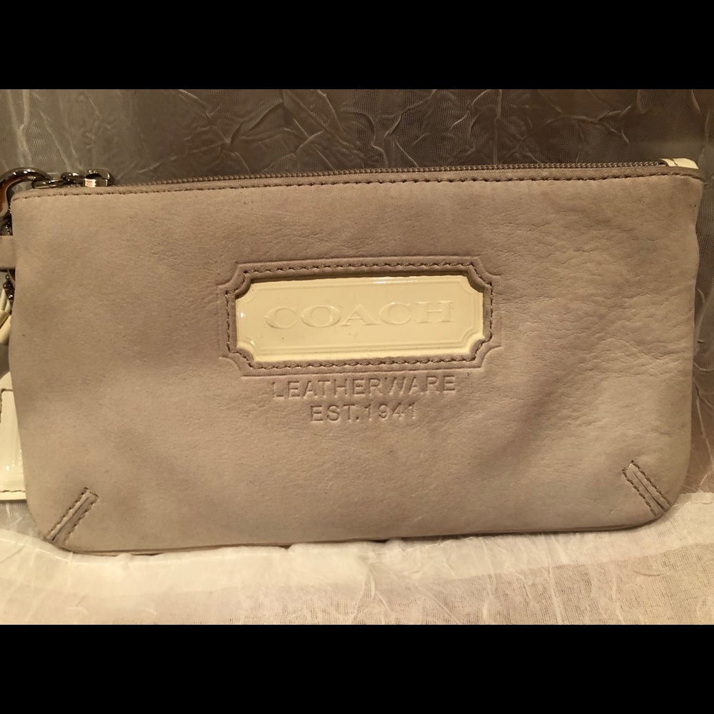 COACH leather wristlet in tan and white